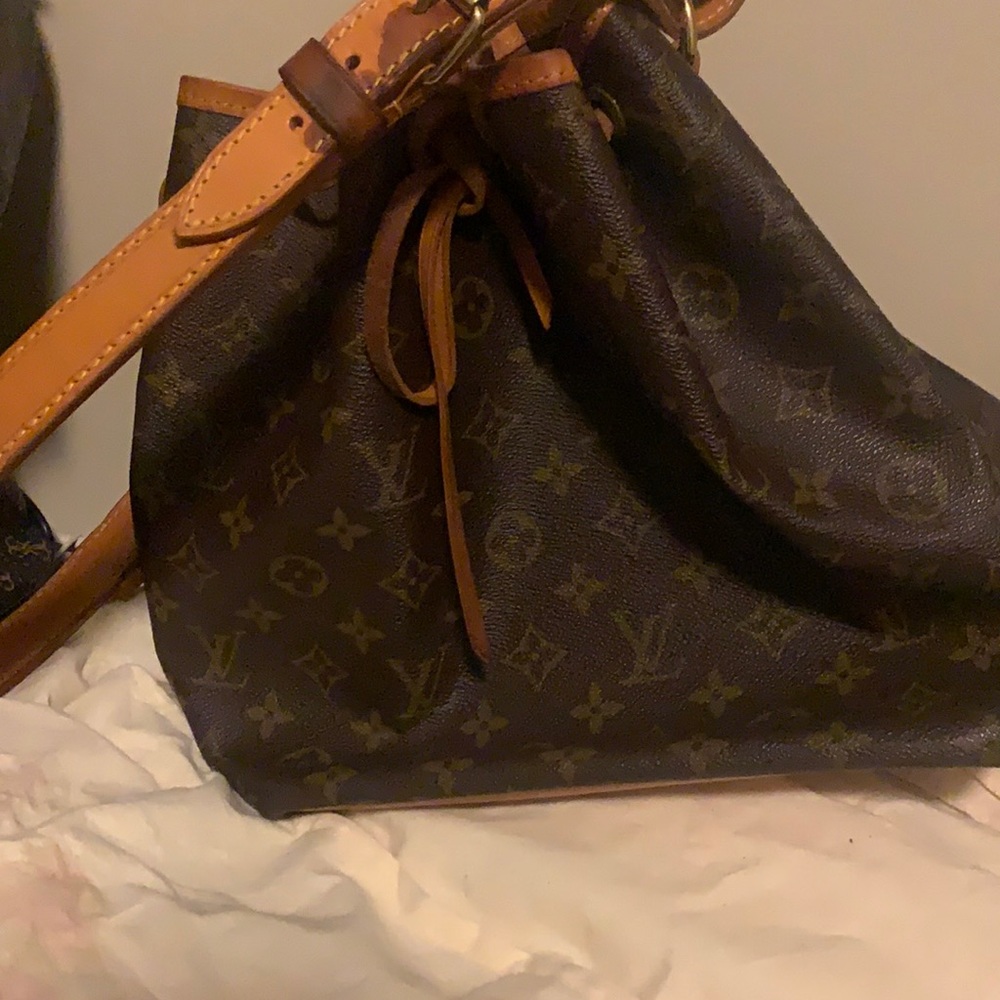 100% real Louis Vuitton bag. Have authentic card. Got it as a gift from my ex.